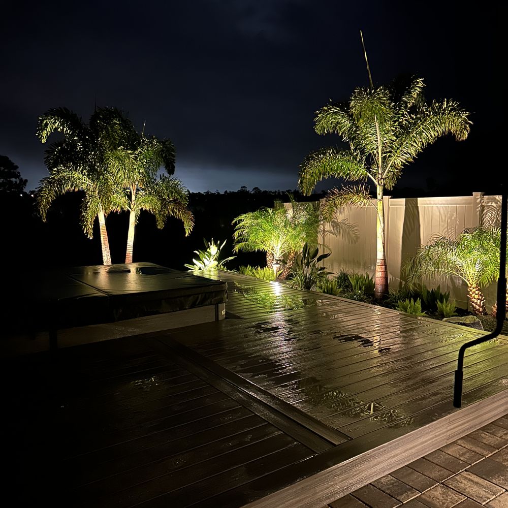 installing landscape lighting at a home in palm beach
